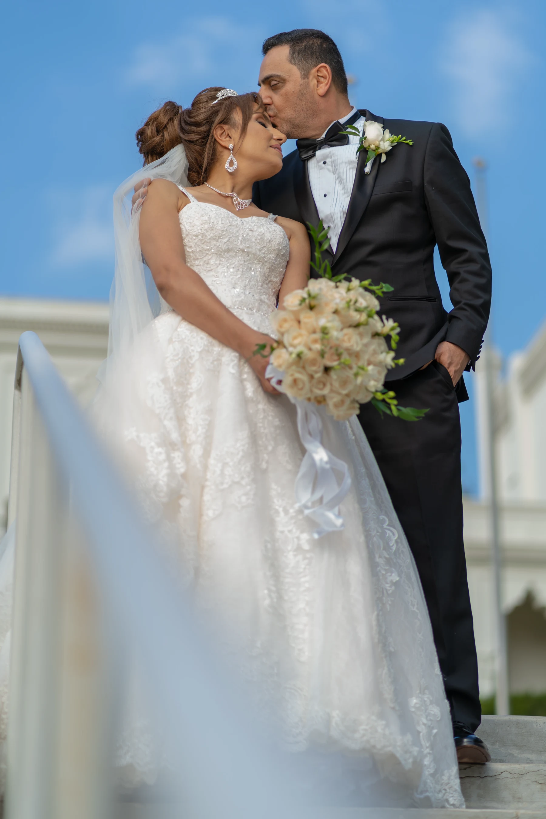 A Los Angeles wedding videographer filming a couple's first dance at golden hour on a rooftop venue