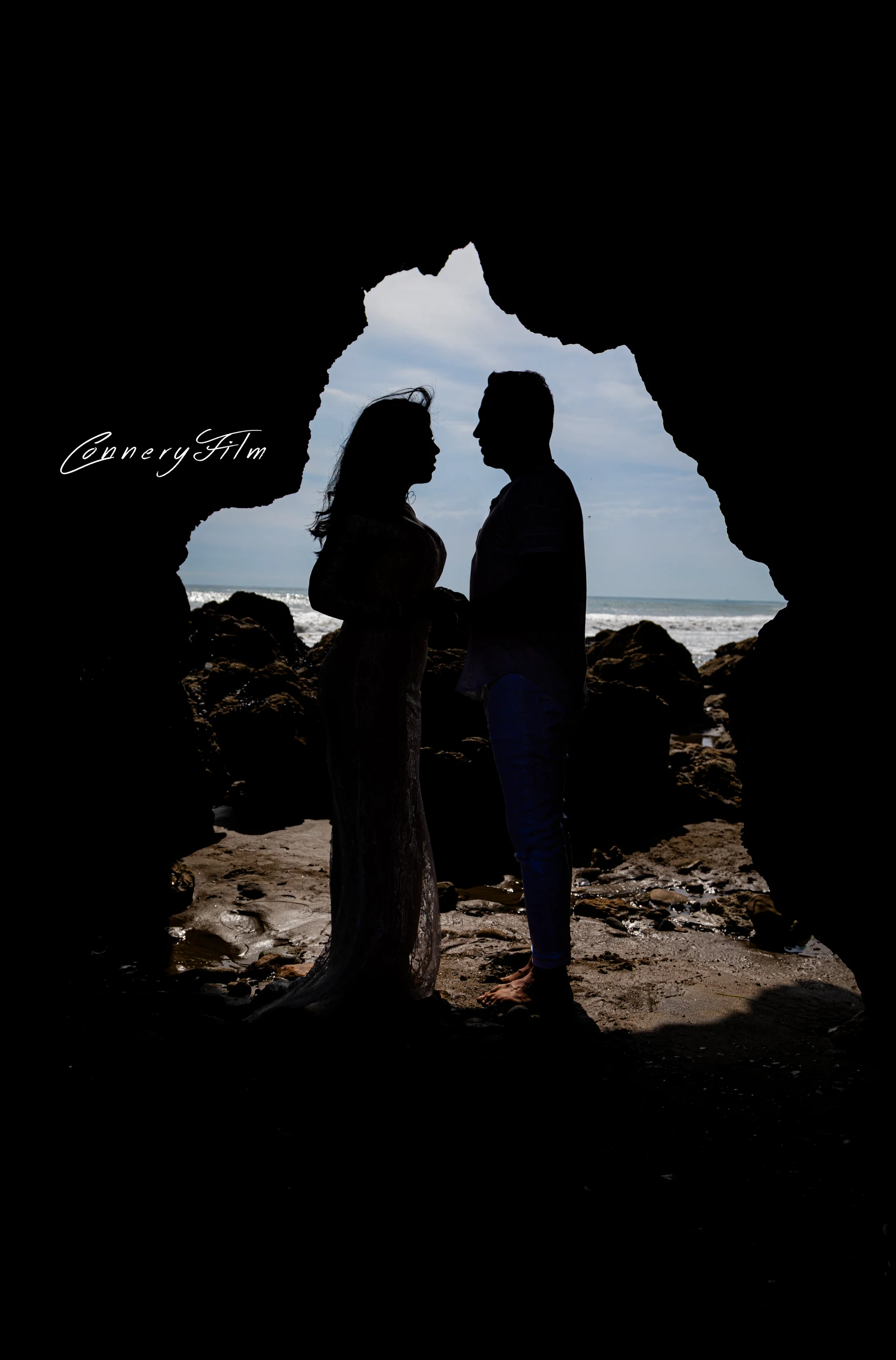 Bride and groom posing for wedding photos in front of a castle backdrop at a Disney theme park during golden hour.